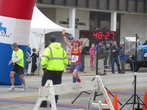 Me crossing the finish line of the Rodes City Run 10K