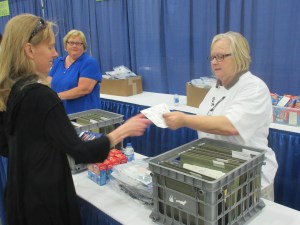 The infamous receiving the race bib shot at the expo. We were going to pose, but Cathy took the picture already!